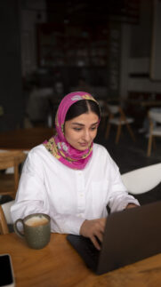 medium-shot-woman-working-with-hijab-indoors medium-shot-woman-working-with-hijab-indoors